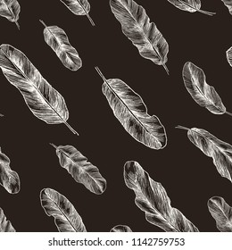 Seamless pattern with hand-drawn feathers. Hippie design elements. White elements on black back. Vector design