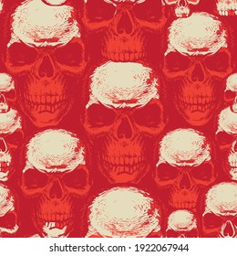 Seamless pattern with hand-drawn human skulls. Abstract vector background with scary skulls on a red backdrop. Suitable for wallpaper, wrapping paper, textiles, design element for halloween party