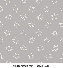 Seamless pattern with hand-drawn light stars on a gray background
