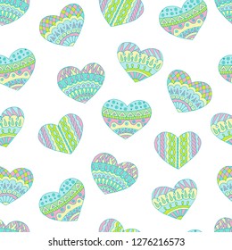 Seamless pattern of hand-drawn and pastel colored doodle hearts for Valentine's day on white background