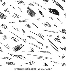 Seamless pattern of hand-drawn pencil strokes and scribbles. Various black shapes on white background. Vector illustration.