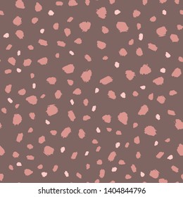 Seamless pattern with hand-drawn specks in pale pink colours on a brown background. Vector illustration, background. The picture can be used separately from the background.