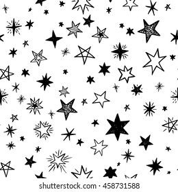 Seamless pattern with handdrawn stars. Doodle monochrome vector illustration.