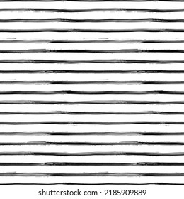 Seamless pattern with handdrawn thin lines. Hand painted grungy ink doodles in black and white colors. Horizontal simple stripes, texture brush strokes. Classic black and white stripes pattern.