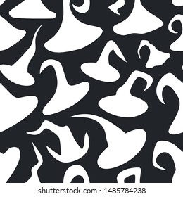 Seamless pattern of hand-drawn witch hats silhouettes images. Ornament with different isolated white Halloween costume elements on black background. Suitable for wrap paper, fabric textile,  apparel