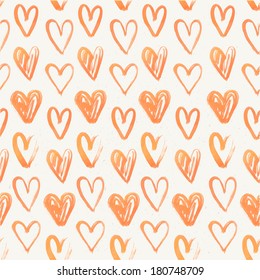 Seamless pattern of hand-painted red hearts on a grungy background