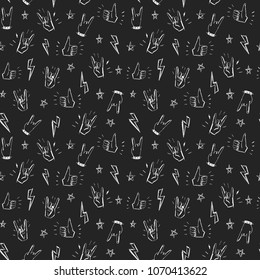 Seamless pattern with hands showing cool rock and roll signs. Hand drawn background for your design.
