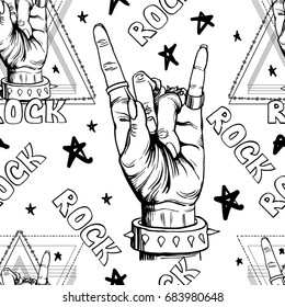 Seamless pattern with hands showing cool rock and roll signs. Hand drawn background for your design.