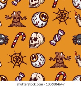 Seamless pattern happy halloween icons isolated on orange Premium Vector