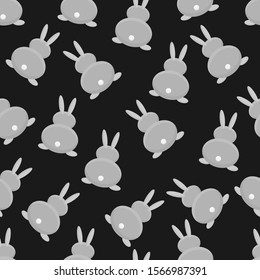 Seamless pattern. Hare view from the back. on a black background. vector.