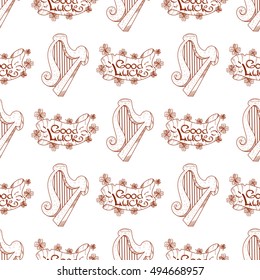 Seamless pattern with a harp and a banner of good luck.