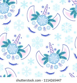 Seamless pattern with head of hand drawn unicorns and snowflakes
