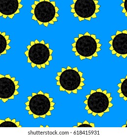 seamless pattern of heads of sunflowers on a blue background