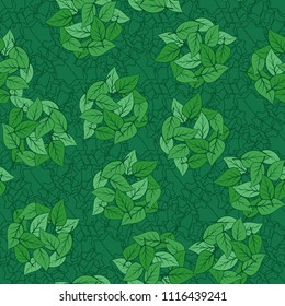 Seamless pattern. Heaps of fallen leaves arranged in random order. Multi-colored texture. The background is a ligature from the contours of the seven-pointed stars.