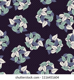 Seamless pattern. Heaps of fallen leaves arranged in random order. Multi-colored texture. The background is a grid of squares, which consist of diagonal lines.