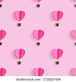 Seamless pattern with heart hot air balloon paper art style on light pink background, Pattern graphic style, Vector illustration
