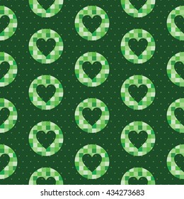 Seamless pattern with a heart shape inside the circle made in mosaic style and polka dot background. Bright shades of the green color.