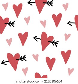 Seamless pattern with hearts and arrows.