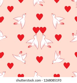 Seamless pattern. Hearts and birds. Valentine's Day. On a pink background are white birds and red hearts. Vector image.