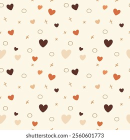 A seamless pattern of hearts and crosses in various shades of brown and orange on a cream background. The hearts are of different sizes and the crosses are small and delicate. 