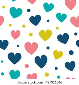 Seamless pattern with hearts and dots of fresh colors on a white background. Simple vector repeating texture.