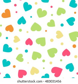 Seamless pattern with hearts and dots of fresh colors on a white background. Vector repeating texture.