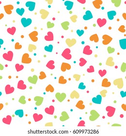 Seamless pattern with hearts and dots of fresh colors on a white background. Vector repeating texture. Perfect for printing on fabric or paper.