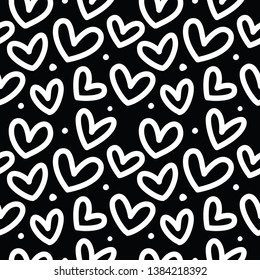 Seamless pattern with hearts on a black background.