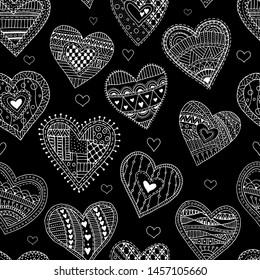 Seamless pattern with hearts on a black background. Vector. Hand drawn