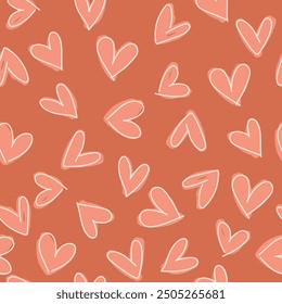 Patrón sin fisuras con corazones, sobre fondo marrón.	