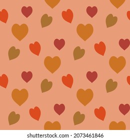 Seamless pattern with hearts on light orange background. Vector image.