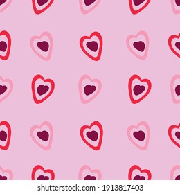 Seamless pattern with hearts on a pink background. For Valentine's Day. For wallpapers, textiles, backgrounds, covers and packaging.