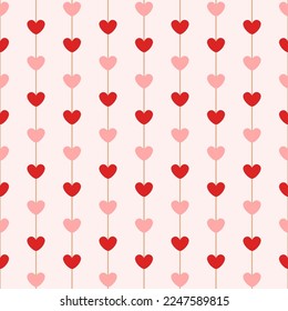 Seamless pattern with hearts on vertical stripes