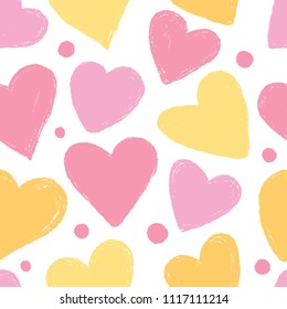 Seamless pattern with hearts in pink and yellow tones.