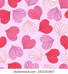 Seamless pattern of hearts in pink-red colors. Vector graphics.