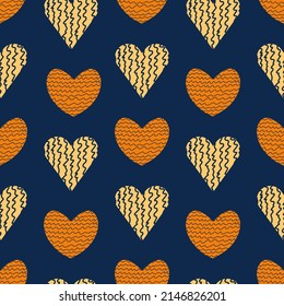 Patrón sin foco de corazones con ranuras en forma de olas. Colores amarillos y anaranjados en un fondo azul. Dibujar corazones en un orden caótico. Ilustración vectorial para tela, fondos, papel envolvente