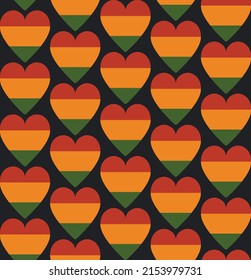 Seamless pattern with hearts in traditional Pan African colors - red, yellow, green, black background. Backdrop for Kwanzaa, Black history month, Juneteenth greeting card, banner, textile print