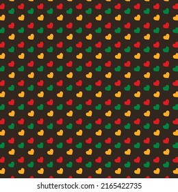 Seamless pattern with hearts in traditional Pan African colors - red, yellow, green on Mocha Mousse color of the year 2025. background for Juneteenth, Kwanzaa, Black history month modern template