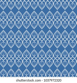 Seamless pattern with hearts. White hearts on a blue background. Vector illustration.