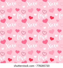 Seamless pattern of hearts and words with pink background for valentine’s day