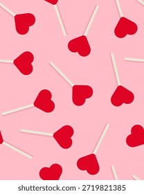 Patrón sin fisuras de piruletas en forma de corazón sobre un fondo rosa