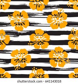 Seamless pattern with hibiscus flowers on striped background. Tropical summer illustration. Vector.