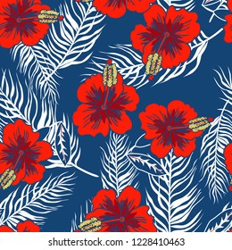 Seamless pattern with hibiscus flowers and palm leaves.