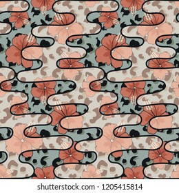 Seamless pattern with hibiscus flowers and print skins of an exotic animal.