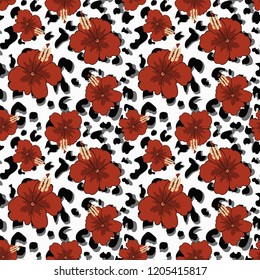 Seamless pattern with hibiscus flowers and print skins of an exotic animal.