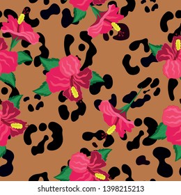 Seamless pattern with hibiscus flowers and print skins of an exotic animal. Vector pattern.