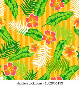 Seamless pattern of hibiscus flowers and tropical leaves on yellow stripes background.