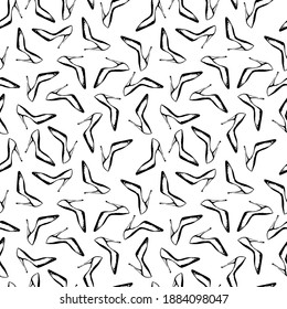 Seamless pattern with high heels glamour shoes. Hand drawn black and white pattern isolated on white background. Design for textile, wrapping paper, curtains, clothes, home decor.