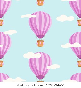 Seamless pattern with hot air balloons and clouds on a blue background.