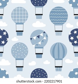 Seamless pattern with hot air balloons flying on sky. Hand drawn airship on blue background. Vector illustration. 